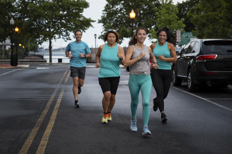 Team members running together outdoors